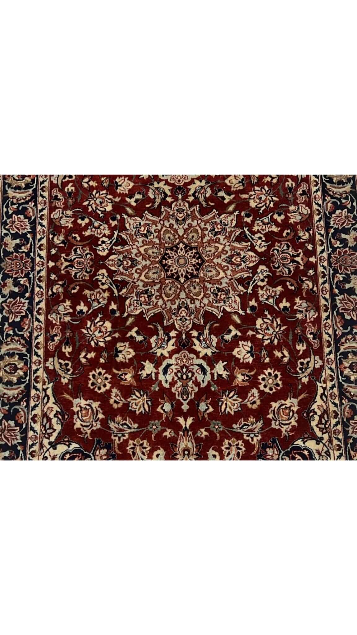 Hand-knotted Seirafian Persian rug in black and red, featuring traditional Isfahan craftsmanship.